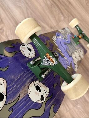 Ripndip Purple Skull Skateboard with Green Trucks and White Wheels
